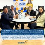 SindicFC-RS Visita à Escola de Gestão Pública da FAMURS.O Presidente do SindicFC-RS, Dr. Vilnei Sessim, realizou uma visita à Escola de Gestão Pública da FAMURS, marcando presença institucional.  Manoela Guns – Assessora Técnica da área de Segurança Pública, Mobilidade e Trânsito da Famurs  Daniela Meller – Diretora da Escola  Rogenio Cavalar – Superintendente Administrativo e Financeiro.